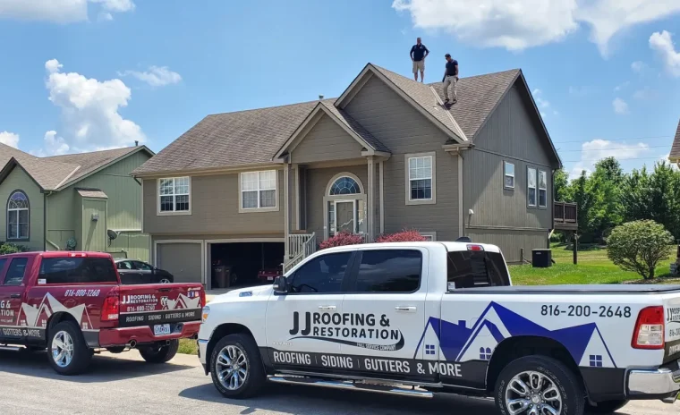 Pick-up parked in front of roofing installed for HOA in Kansas City, MO