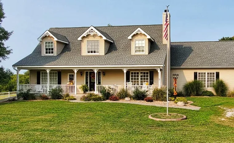 Asphalt shingle roofing on elegant two-story home in Lenexa, KS